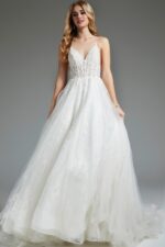 Model wearing flowing ivory Jovani JB07647 dress with lace details.