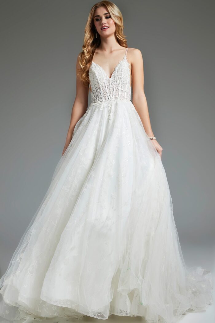 Model wearing flowing ivory Jovani JB07647 dress with lace details.