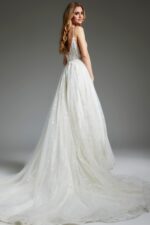 Model in Jovani JB07647 ivory dress, showcasing a graceful tulle skirt from the back.