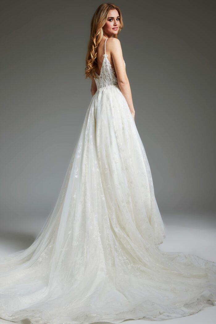 Model in Jovani JB07647 ivory dress, showcasing a graceful tulle skirt from the back.