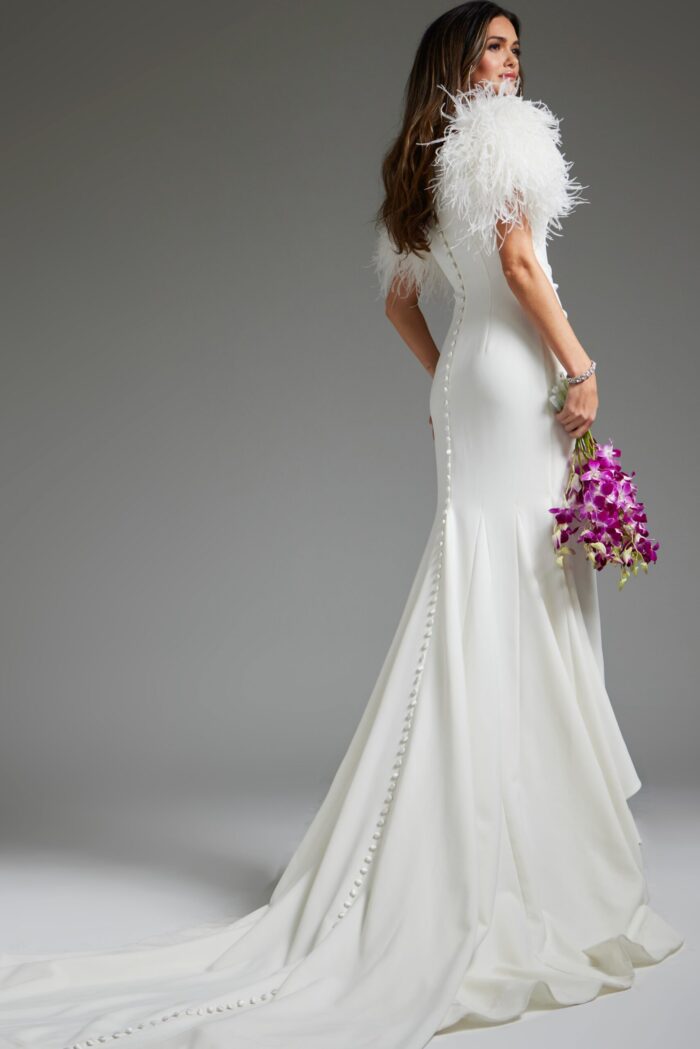Model wearing Jovani JB09153 elegant white gown with feathered sleeves, back view.