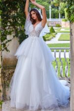 Model wearing Jovani jb09393 elegant white ball gown with lace details