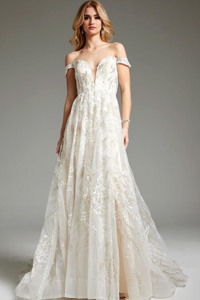 Model wearing JB220001 ivory A-line gown with lace detailing and off-the-shoulder neckline.