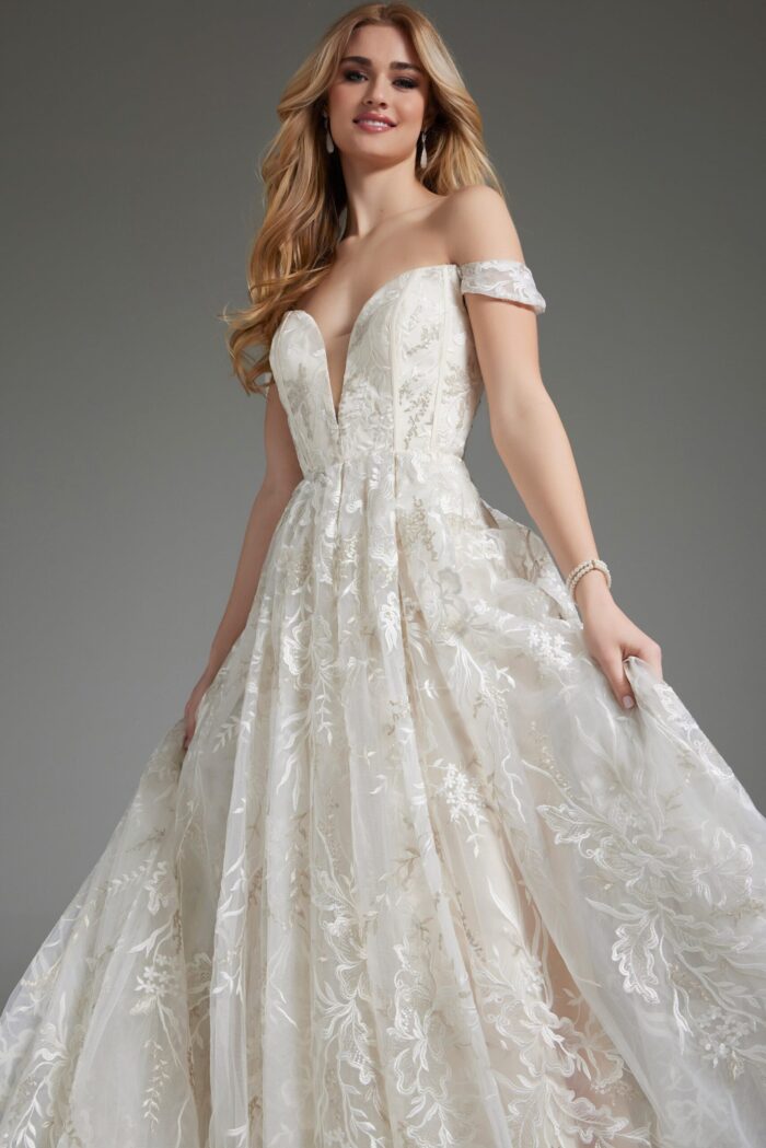Model wearing JB220001 ivory off-the-shoulder gown with lace detailing.