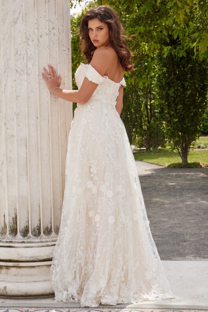 Model wearing Jovani JB220002 ivory dress with lace back view