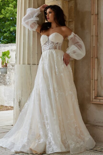 Model showcasing Jovani JB220004 ivory gown with intricate lace details, front view.