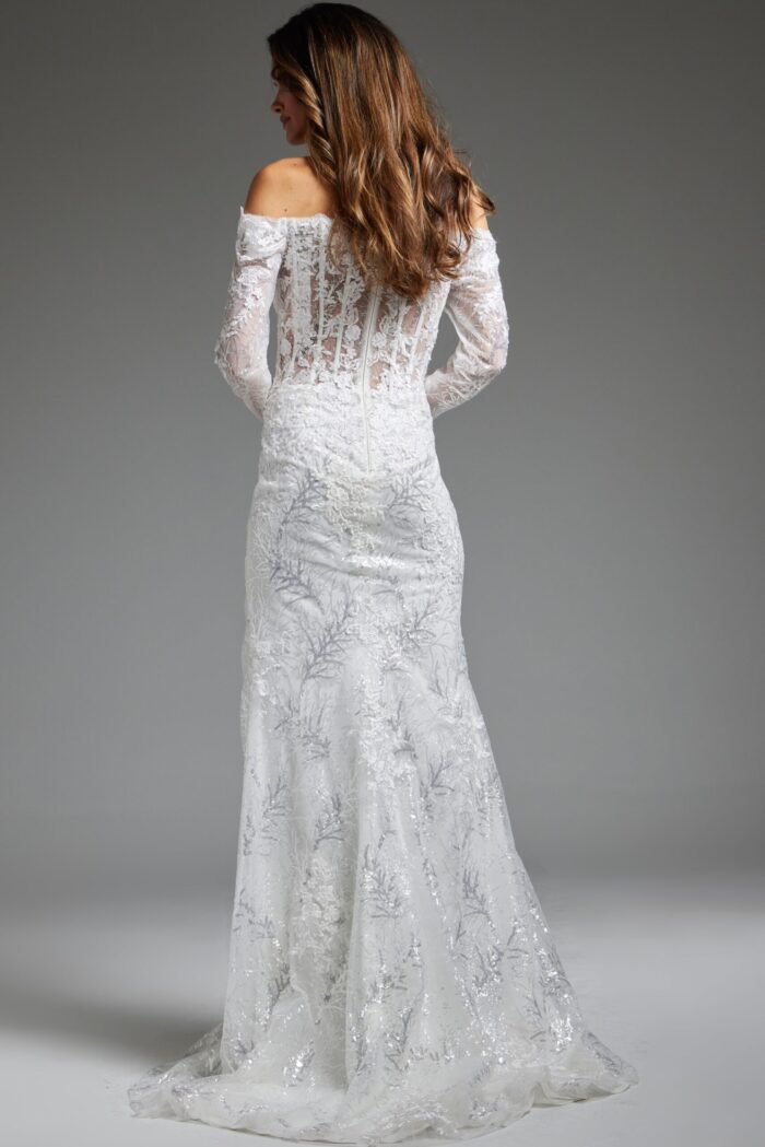 Model wearing Jovani JB23106 white gown, lace detail on back view.