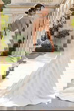 elegant satin bridal dress with structured bodice and long train