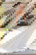 elegant satin bridal dress with structured bodice and long train