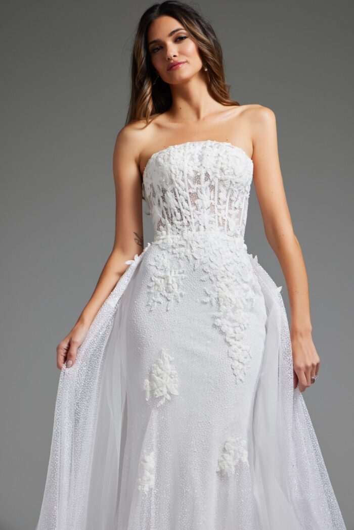 model in Jovani JB24560 white gown with floral details, close-up front view