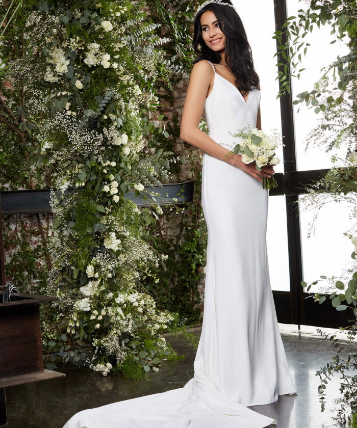Model wearing Jovani JB2507 ivory gown presenting a simple yet elegant design