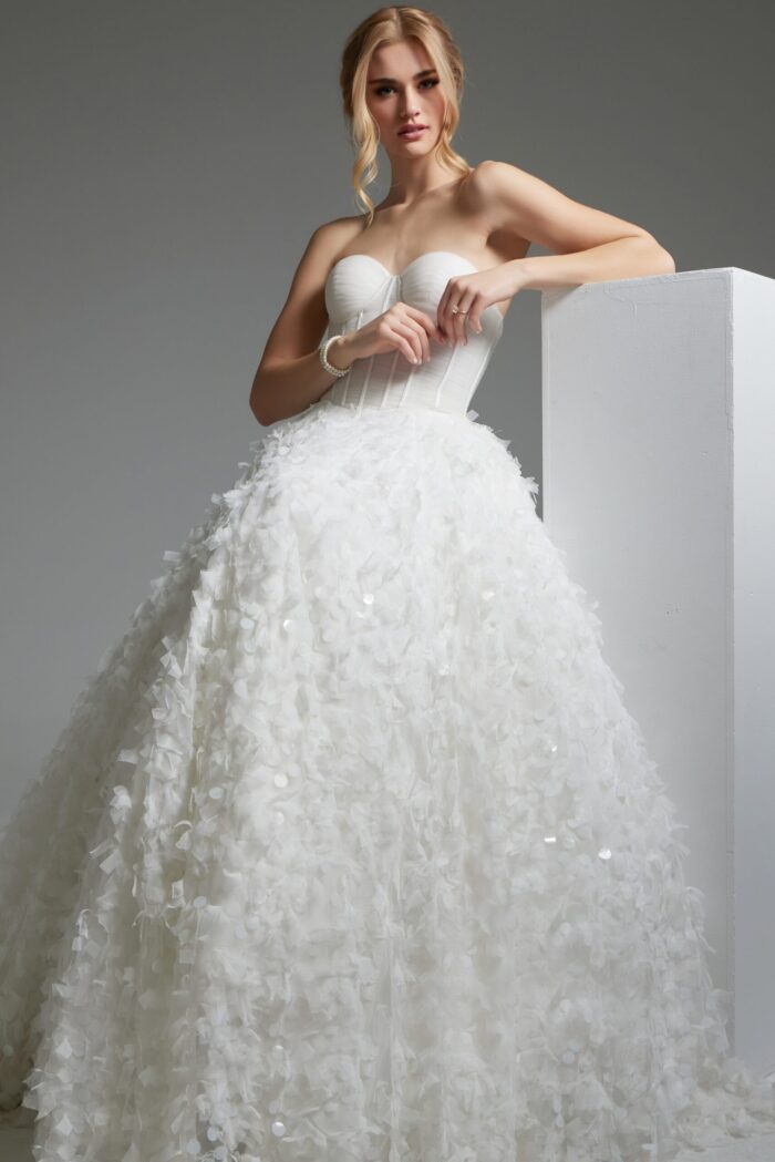 model wearing Jovani JB26295 A-line white dress detailed with floral appliqué