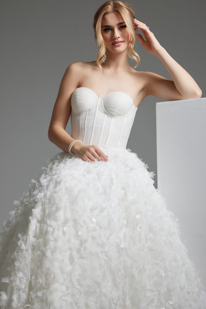 closeup of model in Jovani JB26295 white gown with structured bodice