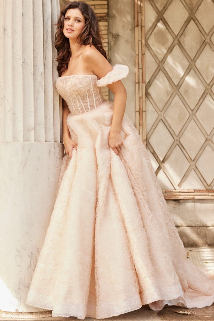 Model wearing JB26341 ivory gown, showcasing an A-line silhouette with off-the-shoulder accents, front view.