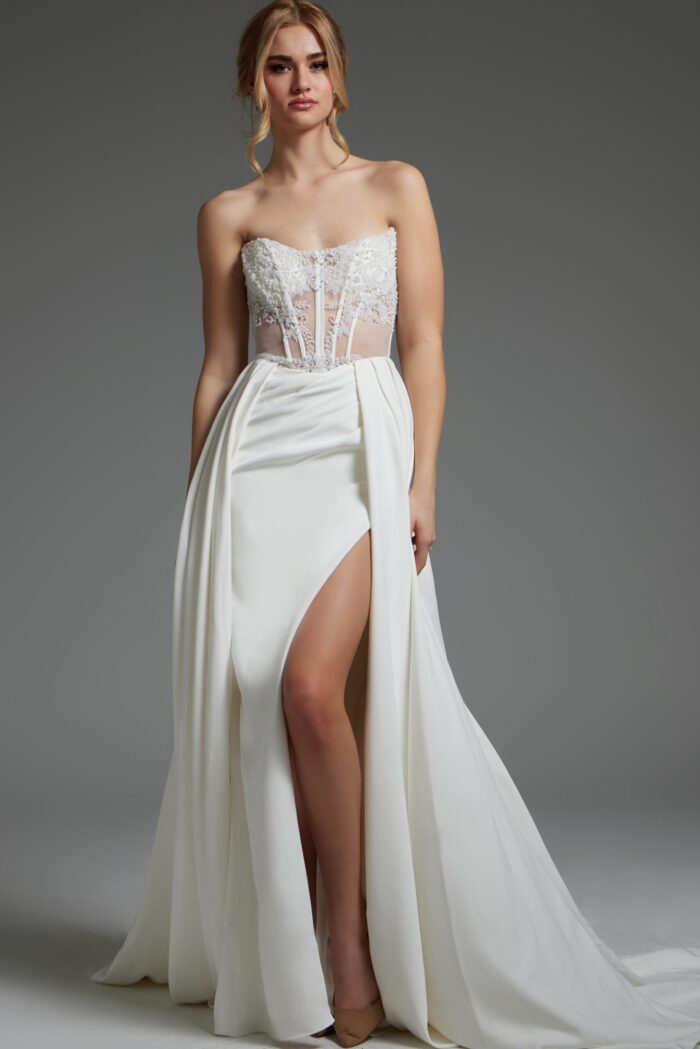 Model wearing Jovani JB37128 ivory dress with sweetheart neckline and high slit.