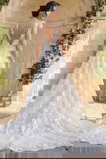 elegant floral lace bridal gown with v neck bodice and flowing a line skirt