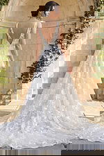 elegant floral lace bridal gown with v neck bodice and flowing a line skirt