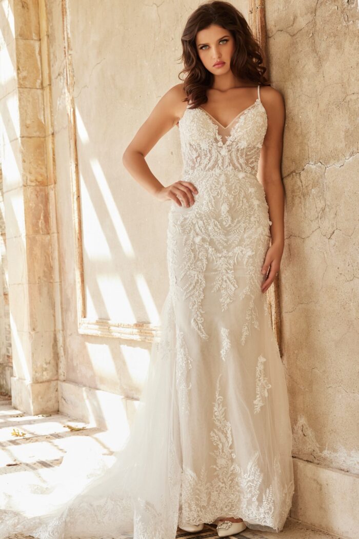 Model in Jovani JB37532 ivory dress with lace and V-neck design from the front angle.