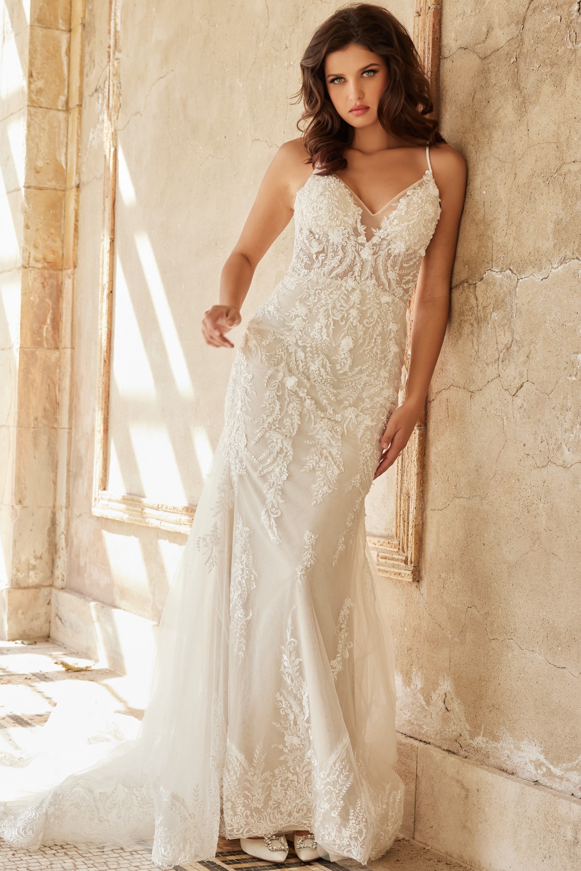 JB37532-4.jpg Model wearing Jovani JB37532 ivory gown with detailed lace V-neckline from the front view.