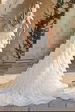 Elegant one shoulder lace wedding dress with sheer detailing and side slit