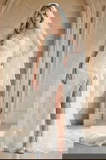 Elegant one shoulder lace wedding gown with thigh high slit and chapel veil