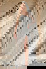 Elegant one shoulder lace wedding gown with thigh high slit and chapel veil