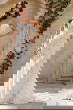 Strapless lace mermaid gown with floral pattern, sweetheart neckline, and fitted silhouette with a soft train.