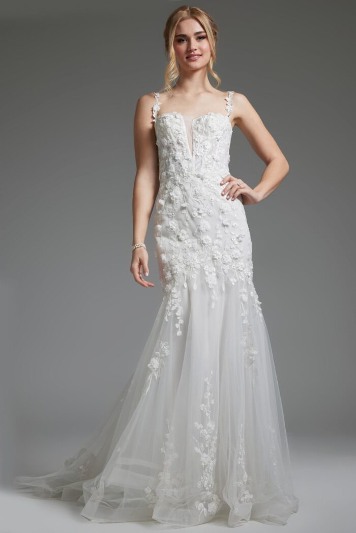 Model wearing JB38479 off-white dress with trumpet silhouette and floral appliqués, front view.