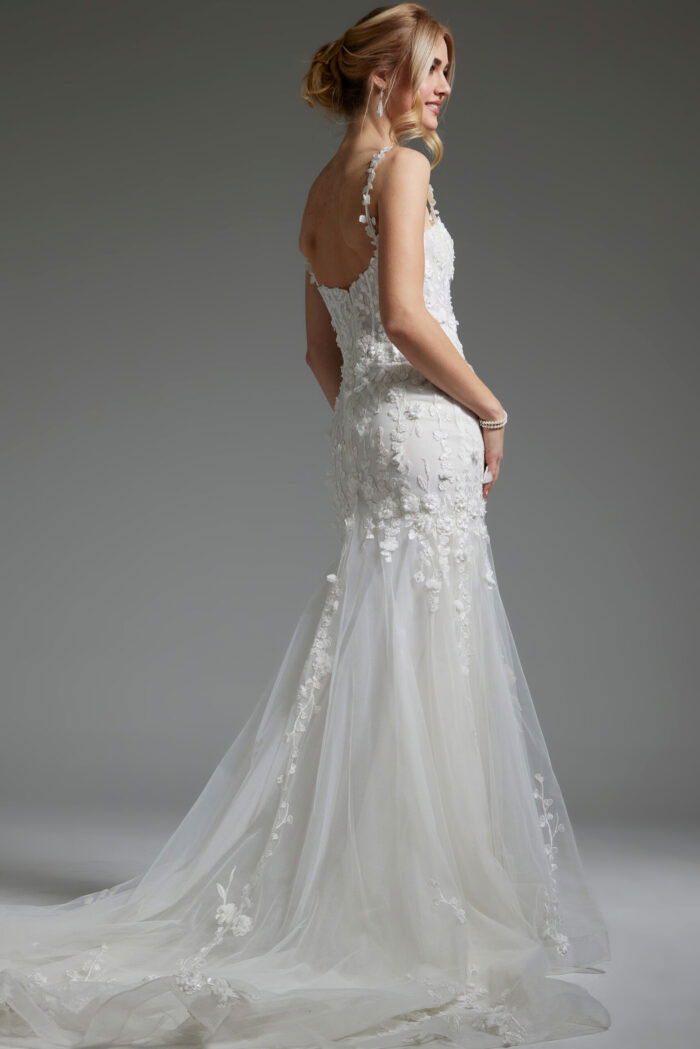 Model showcasing JB38479 off-white dress with a flattering scoop back and trumpet silhouette, back view.