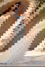 Spaghetti strap lace mermaid gown with floral embroidery and soft tulle train.