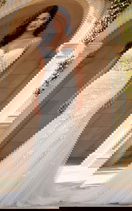 Spaghetti strap lace mermaid gown with floral embroidery and soft tulle train.