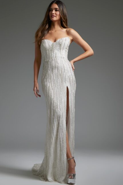 Model wearing Jovani JB39260 long white gown with sweetheart neckline and high slit.