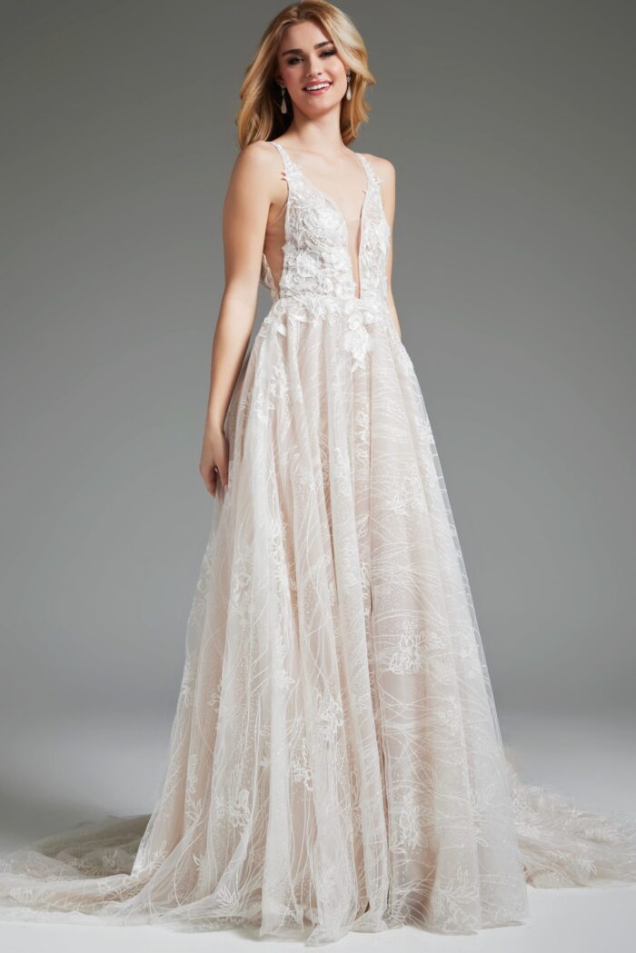Model wearing Jovani 39435, close-up of gown's intricate lace and deep V-neckline.