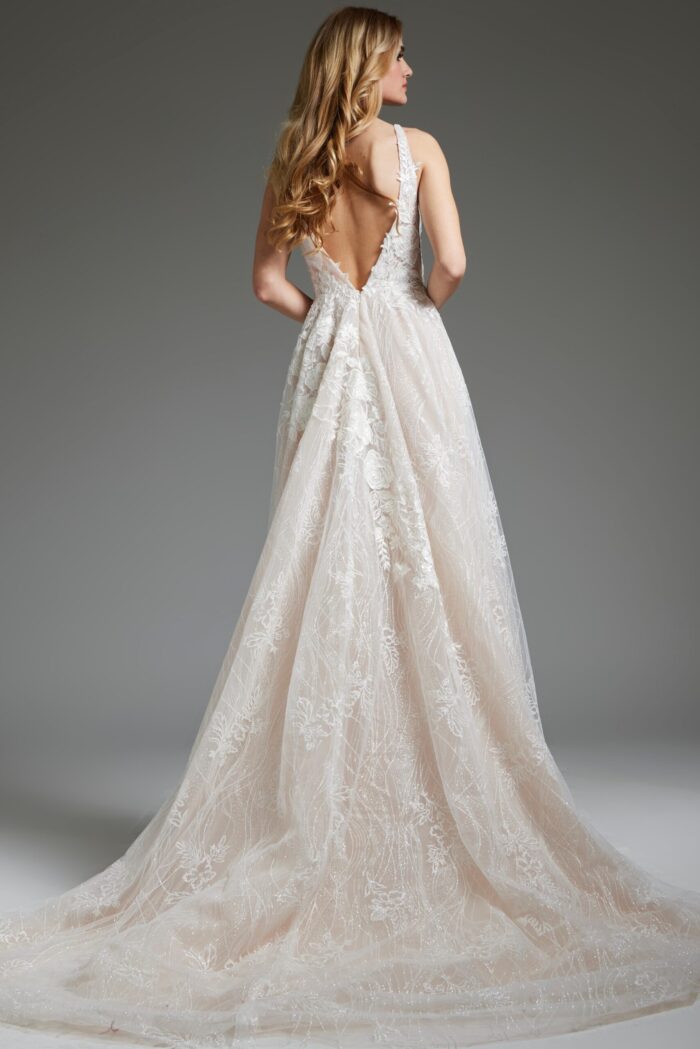 Model wearing Jovani 39435, back view of ivory gown showcasing deep V-back and lace design.