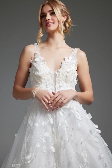 Model wearing Jovani JB40511 ivory gown, close-up front view, with deep V-neckline.