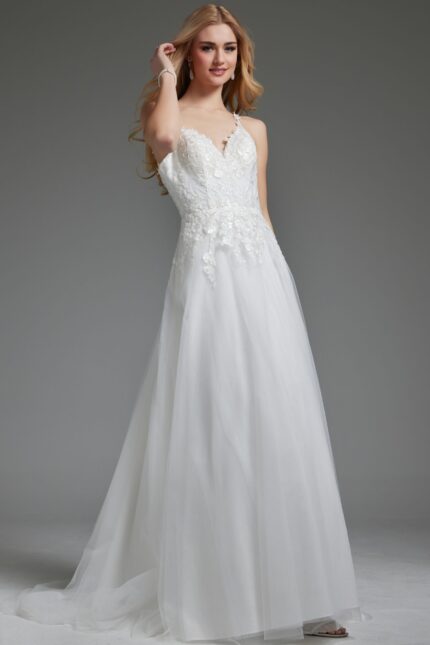 Model wearing Jovani jb40513 ivory gown with V-neckline and floral appliqués.