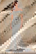 Off shoulder fitted gown with sculpted floral neckline and slight train.