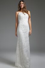 Model wearing JB40608 elegant white gown, front view with strapless neckline and delicate lace detailing
