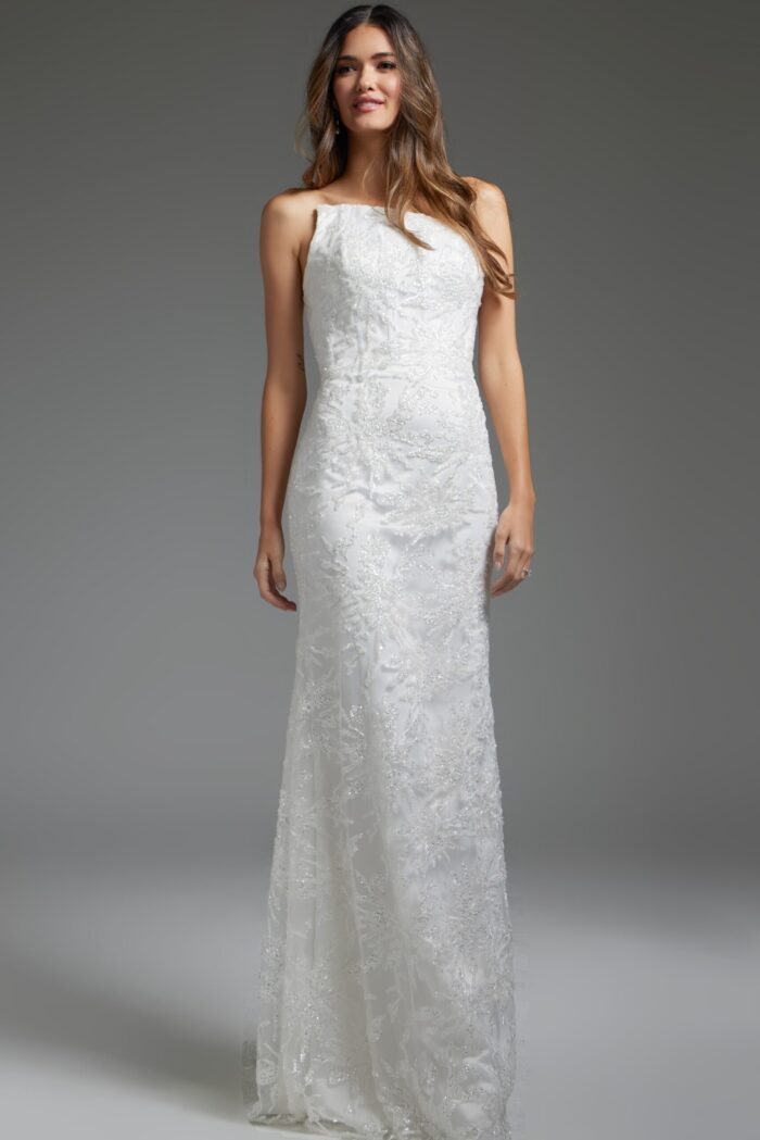 Model wearing JB40608 elegant white gown, front view with strapless neckline and delicate lace detailing