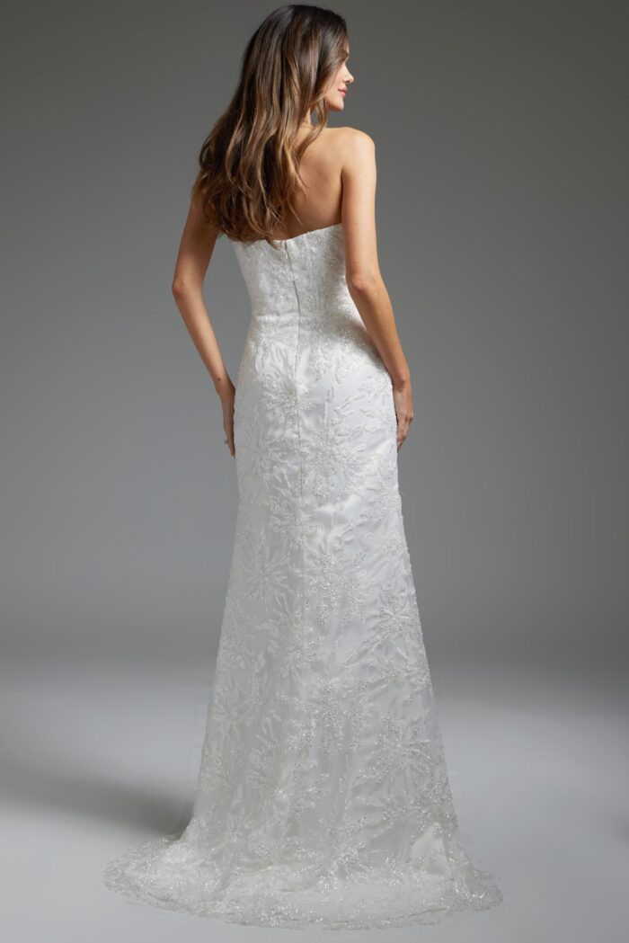 Model wearing JB40608 white gown, back view highlighting the streamlined fit and lace detailing