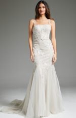 model wearing Jovani JB40631 ivory mermaid gown with floral appliques and tulle skirt