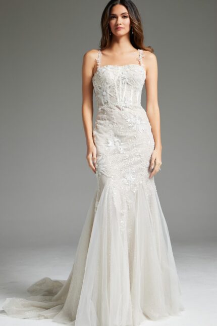 model wearing Jovani JB40631 ivory mermaid gown with floral appliques and tulle skirt