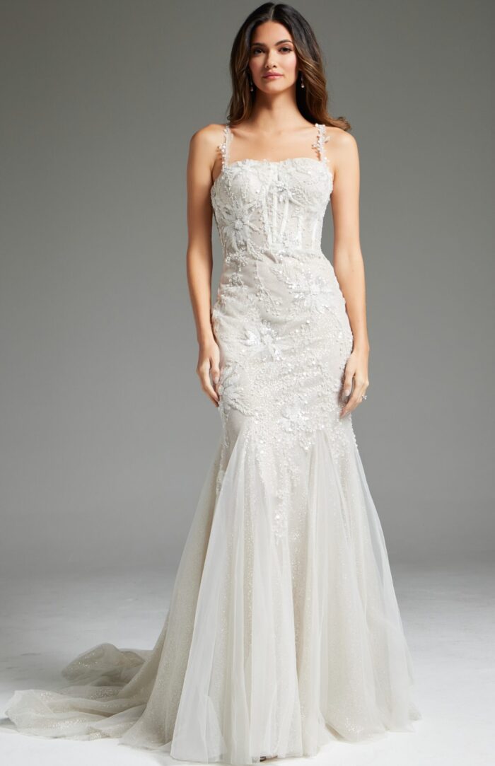 model wearing Jovani JB40631 ivory mermaid gown with floral appliques and tulle skirt