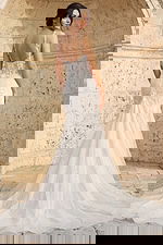 Back view of beaded mermaid wedding dress with floral appliques and sheer straps