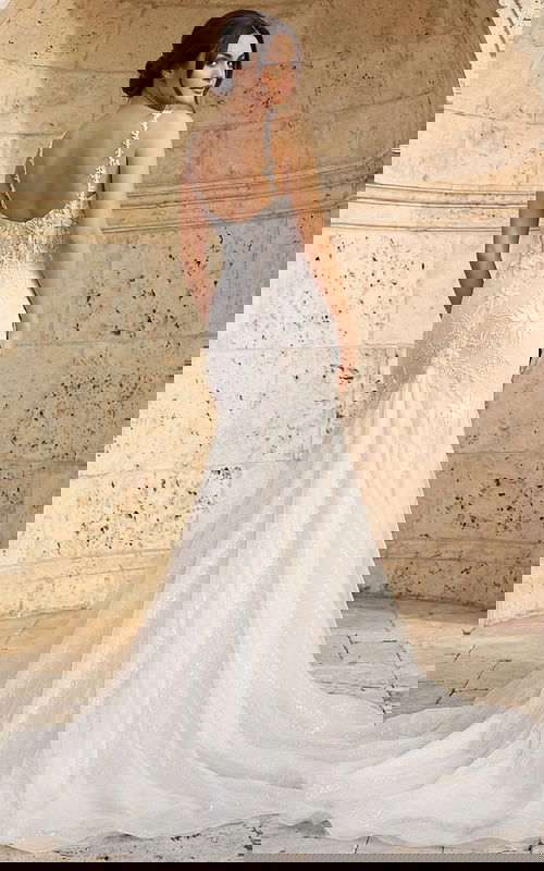 Back view of beaded mermaid wedding dress with floral appliques and sheer straps