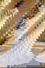 Long train bridal gown with structured corset back and button details