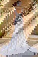 Long train bridal gown with structured corset back and button details