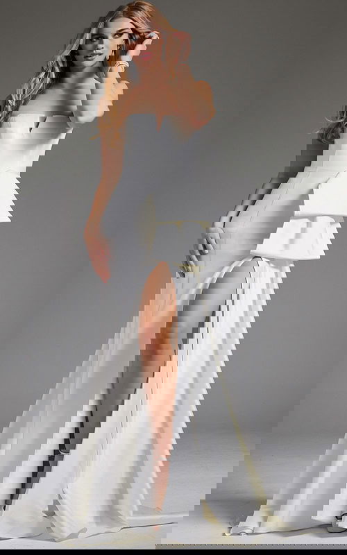 Model wearing Jovani JB40791 white strapless gown with side detail and slit.