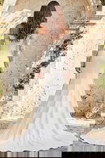 Elegant off shoulder bridal gown with sheer embellished sleeves