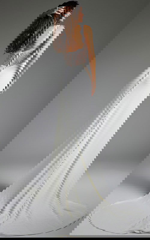 Back view of Jovani JB42222 ivory gown with lace detailing and buttoned train.